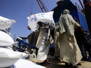 Workers in Port Sudan unload food commodities donated by the United States Agency for International Development (USAID) in October 2016. Photo: AFP/ASHRAF SHAZLY
