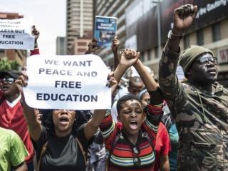 South African students march towards the Union Buildings in Pretoria in October 2016 to call for free higher education. Photo: AFP/MUJAHID SAFODIEN